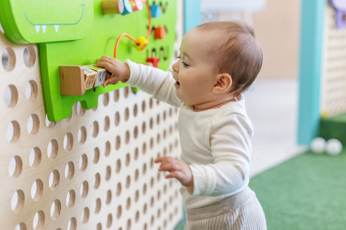 Toddler playing with educational toys at a daycare facility